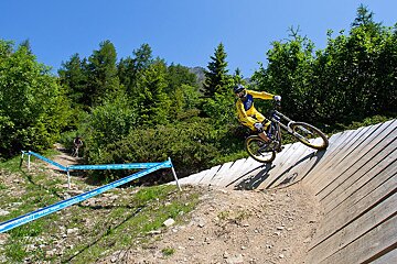 a male mountain biker on a wall ride