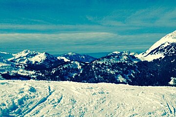 snow and mountains with lots of blue skies