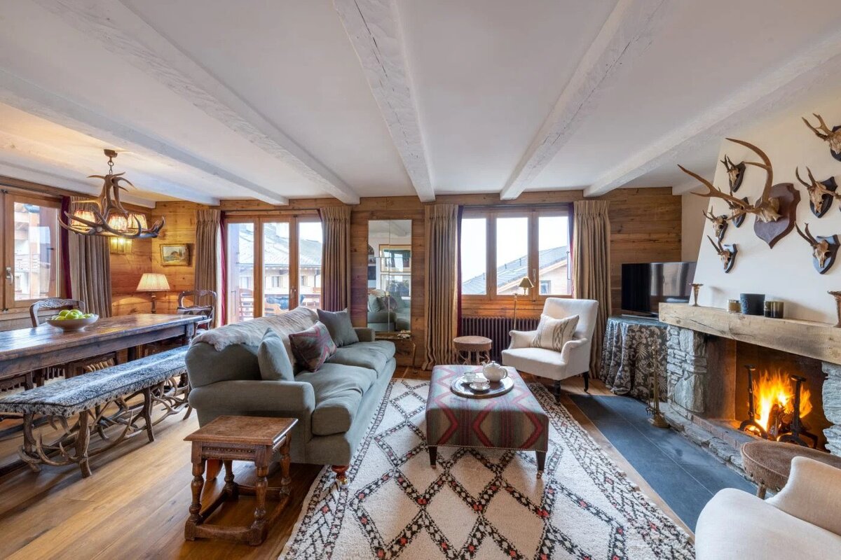 A living room with a fireplace and a couch