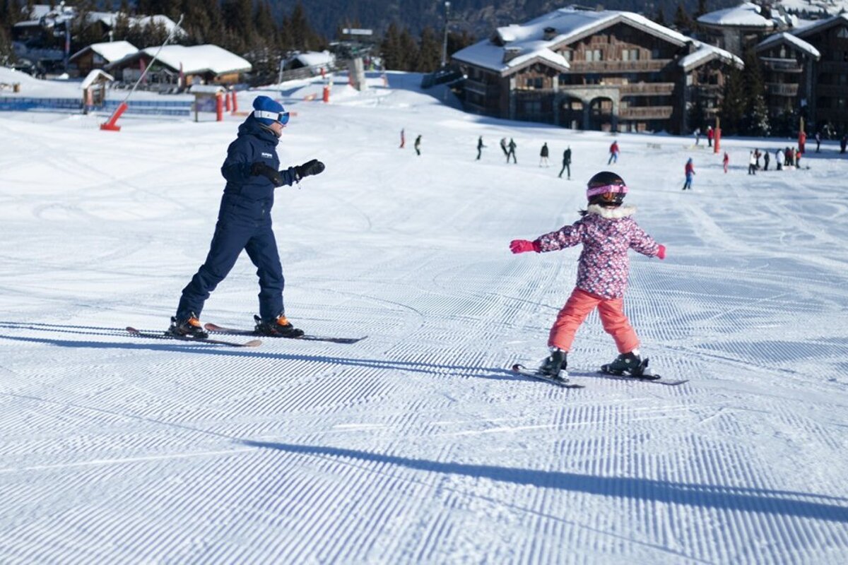 a ski instructor giving a private lesson