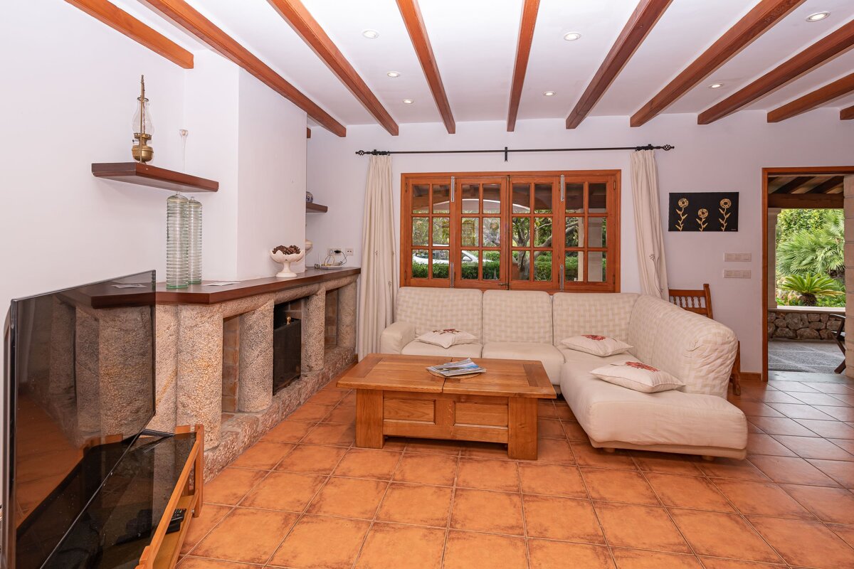 A living room with a couch and a fireplace