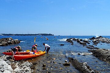 two canoeists about to take to the water