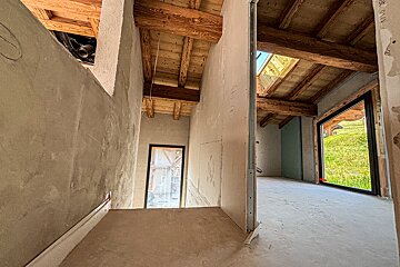 A hallway with a window and a wall that says ' a ' on it