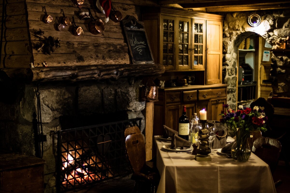A fireplace with a welcome sign above it
