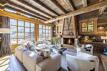A living room with a fireplace and a couch