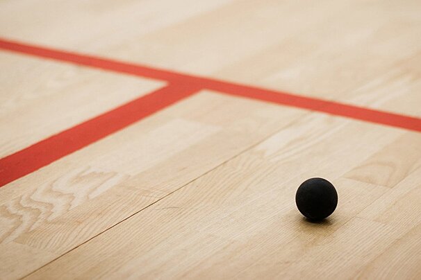 a squash ball on a court
