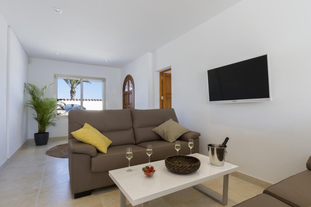 A living room with a couch and a flat screen tv