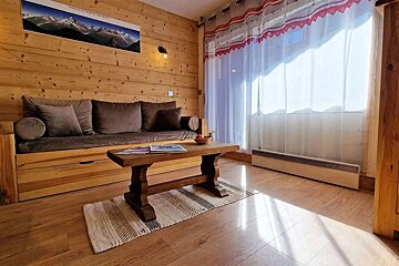 A living room with a couch and a coffee table