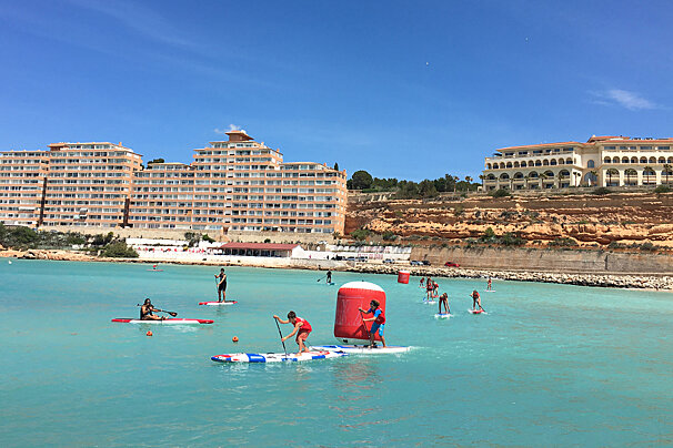 SUP competitors in the water at Port Adriano