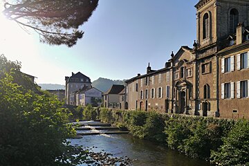 a view of the river with buildings next to it in saint cere