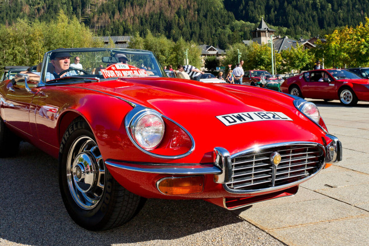 a classic car with red paint and chrome trim