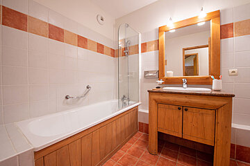 A bathroom with a bathtub and a sink