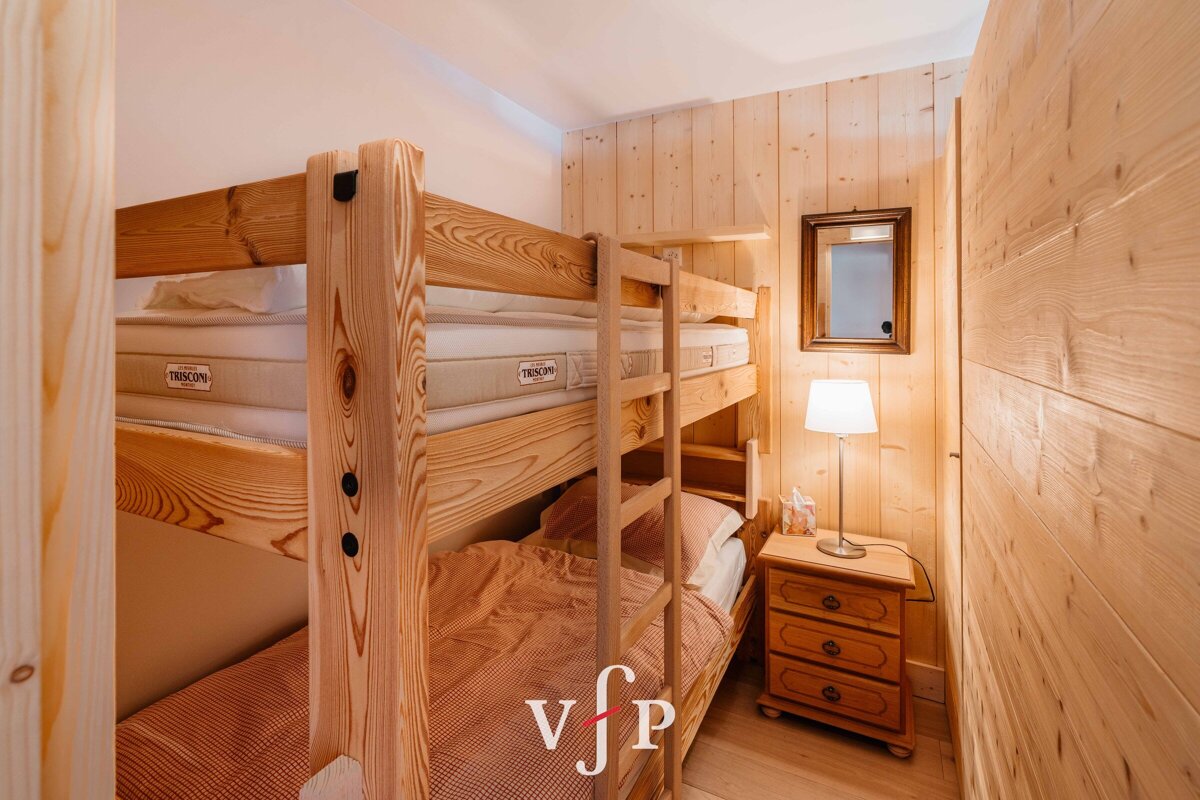 A bunk bed with a mattress on top of it