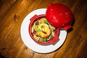 A casserole dish with a lid that says ' emile henry ' on it