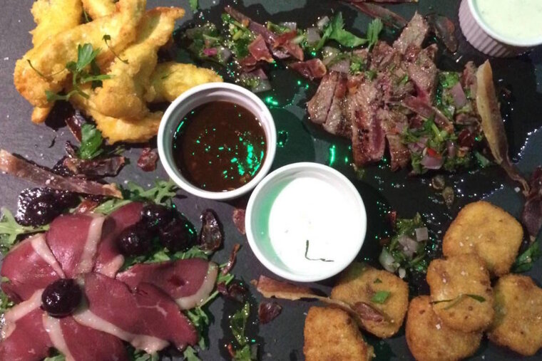 a slate of food in a meribel restaurant