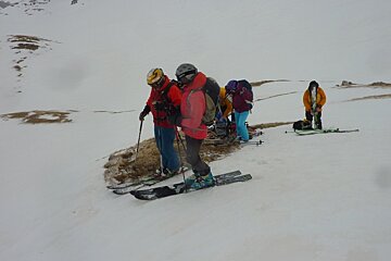 a group of skiers taking a rest