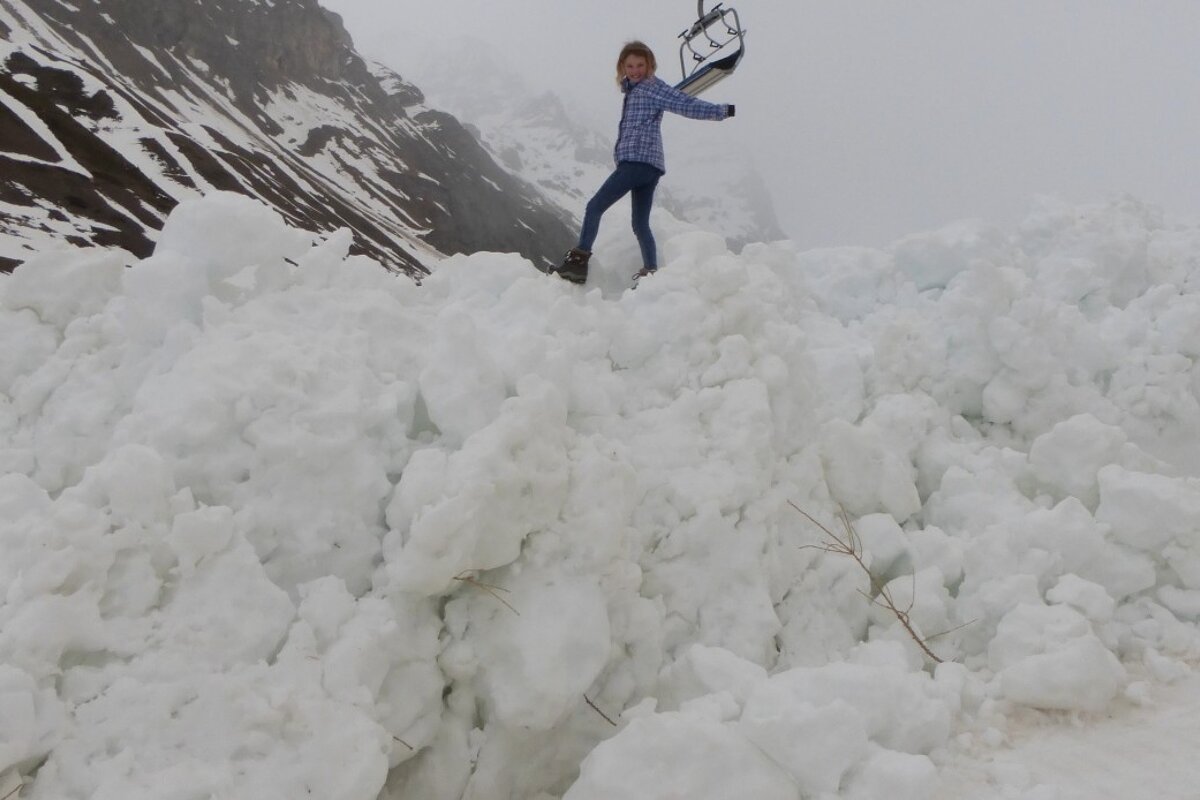 a girl stood on avalanche debris