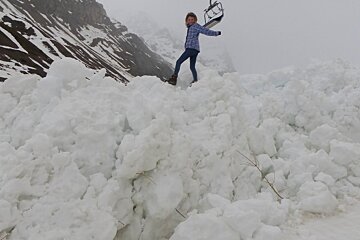 a girl stood on avalanche debris