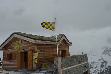 an avalanche flag blowing in the wind