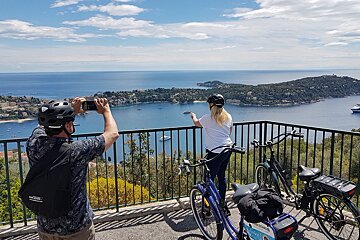 A man taking a picture of a body of water