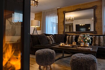 A living room with a fireplace and a couch