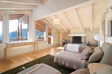 A living room with a couch and a fireplace