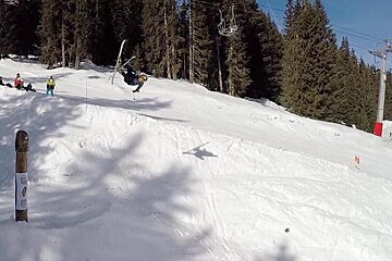 a skier jumping upside down