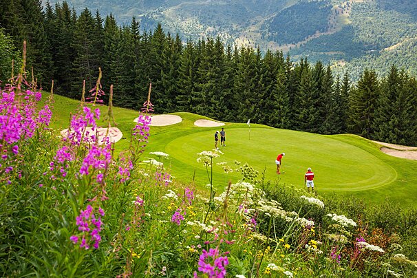 people playing golf on the course at Meribel