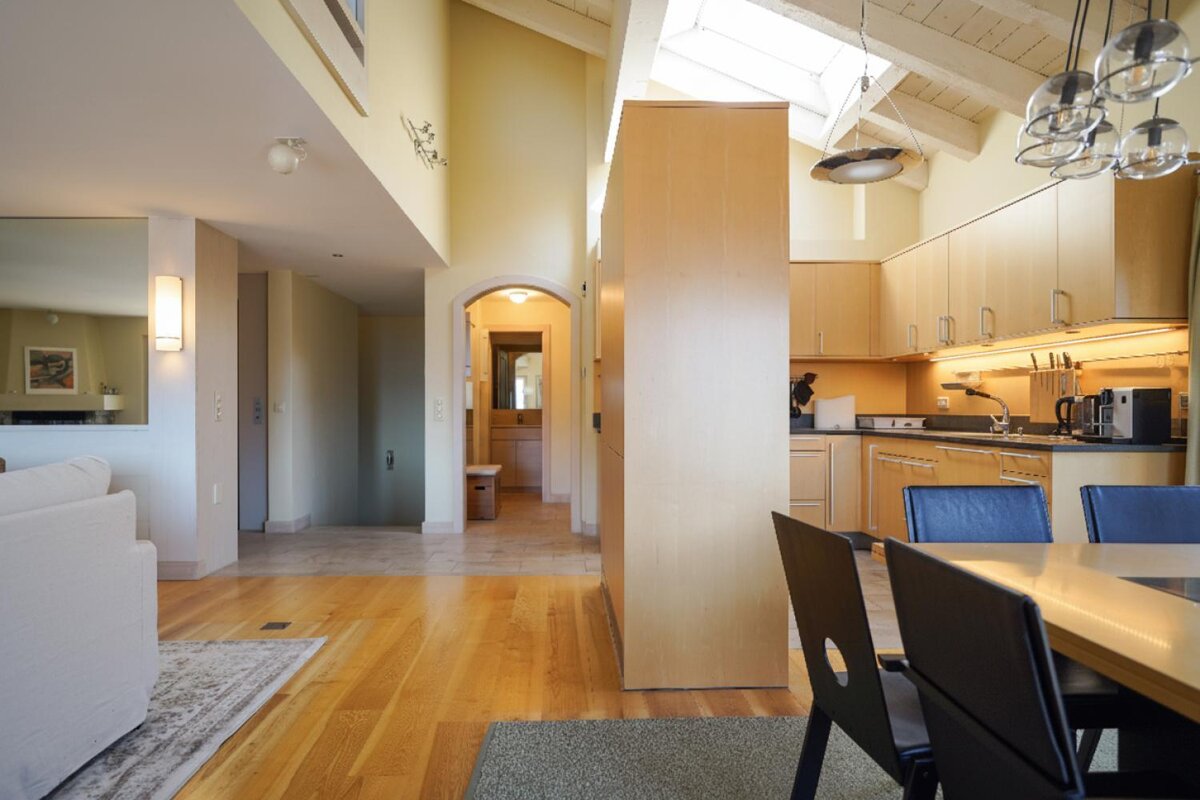 A kitchen with a table and chairs in it