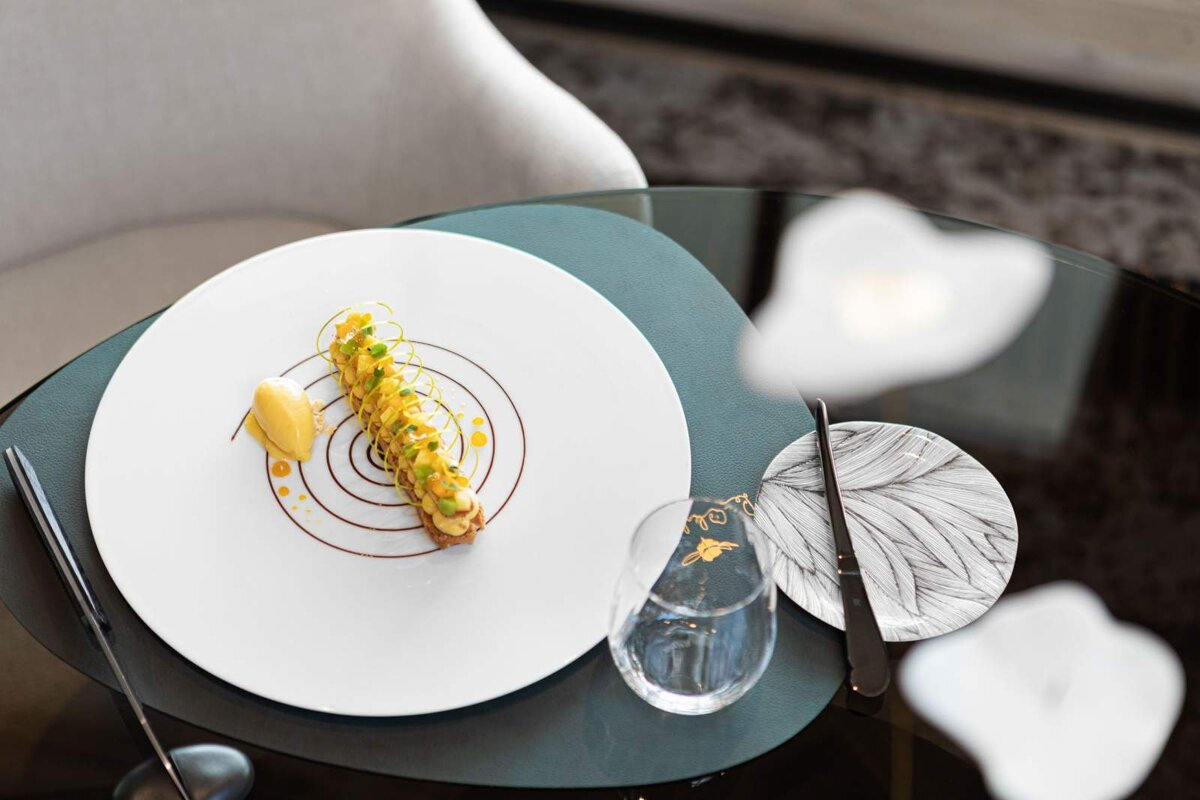 A plate with a dessert on it sits on a table