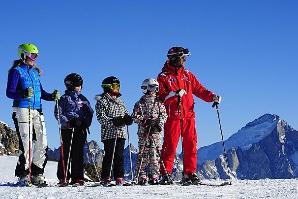 a ski instructor giving a group lesson