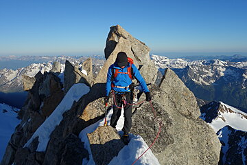 Climber on alpine ridge