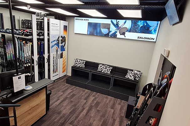 A salomon sign hangs above a waiting area