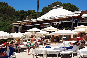a beach club on las salinas beach ibiza