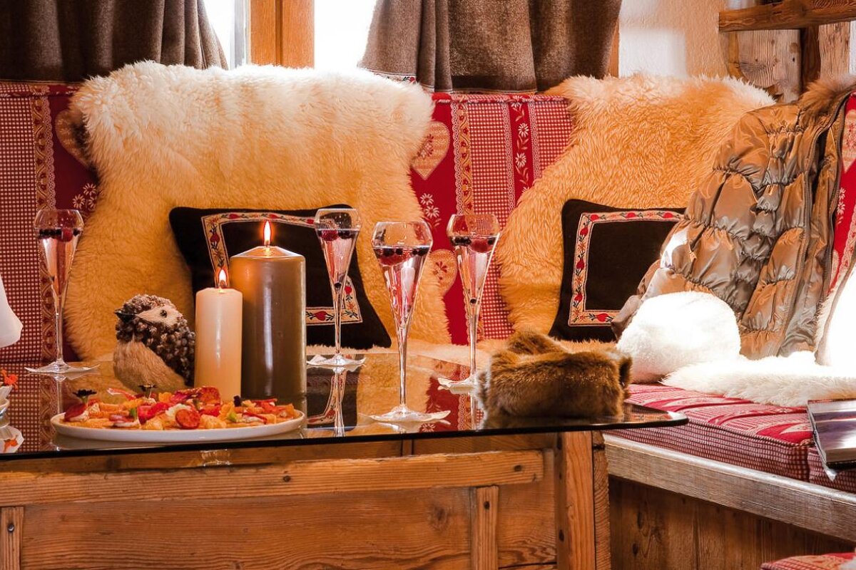 A table with a plate of food and candles on it