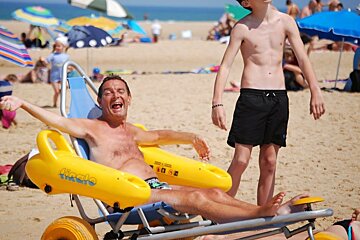 a man in a 3 wheels floating bike