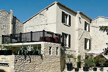 Yellow stone building with plants outside