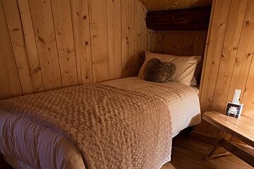 3 single beds in a room in a chalet
