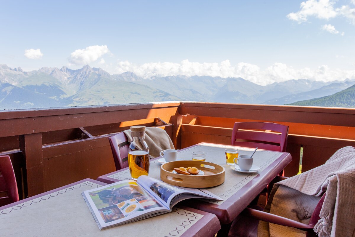 A table with a magazine and a tray of food on it
