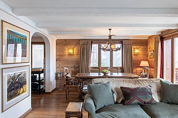 A living room with a couch and a table