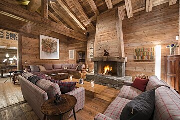 A living room filled with furniture and a fireplace