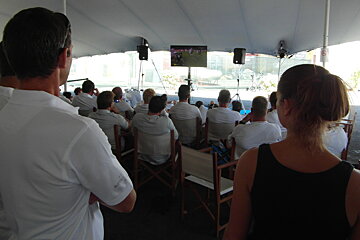 a boat crew watching the rugby