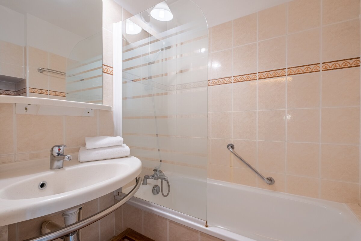A bathroom with a sink and a bathtub