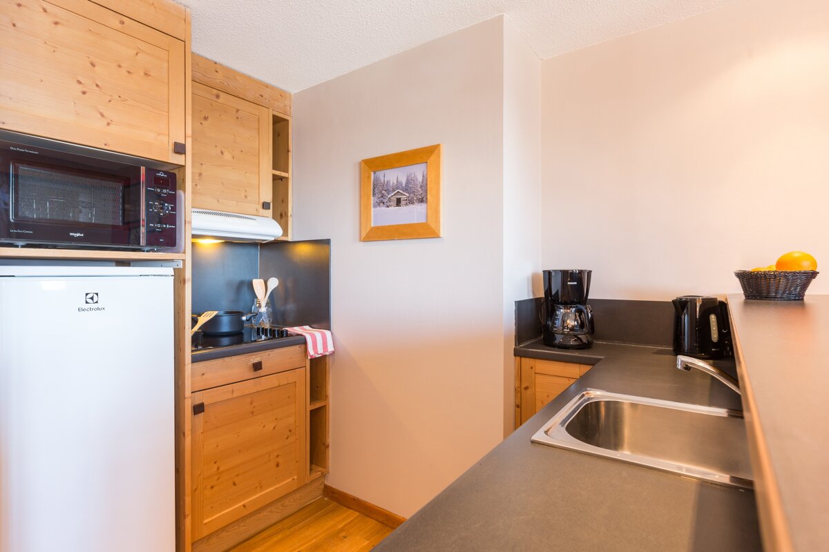 A kitchen with a fridge that says electrolux on it