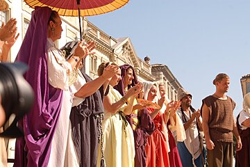 people dressed in Roman clothes