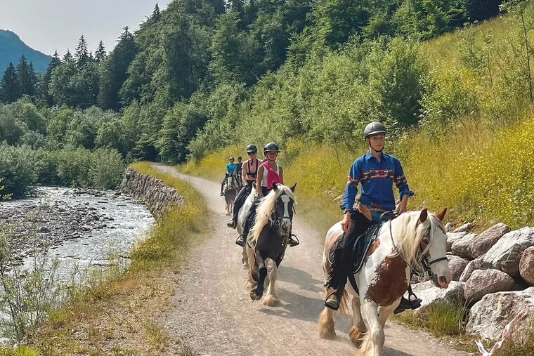 Horse riding along the river in Morzine