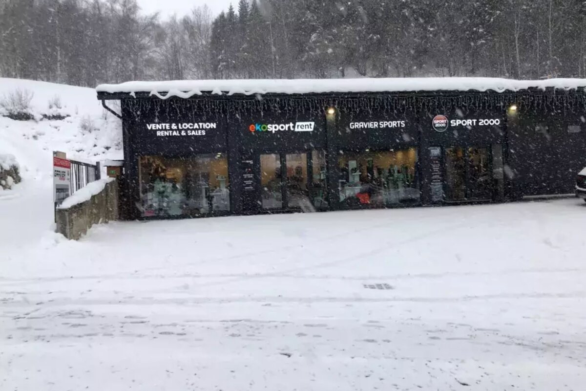 A snow-covered ski rental shop (