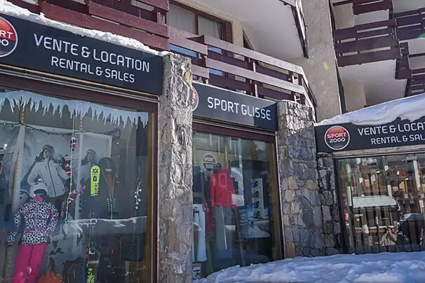 A snow-covered ski rental and sales shop (