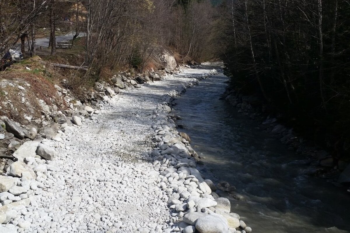 a river with debris piled up on one side