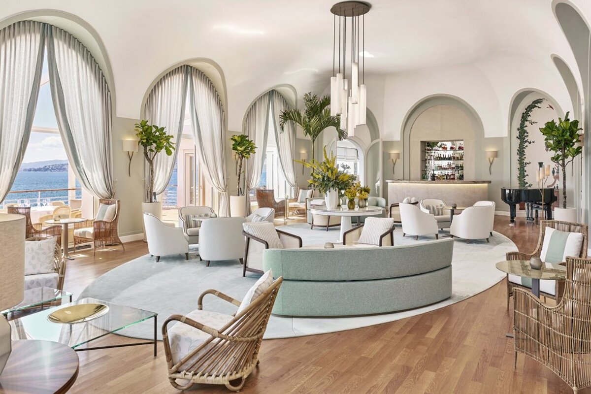 A large room with lots of furniture and a piano